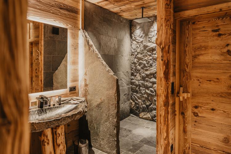 Spacious bathroom with stone sourced from the property's own grounds